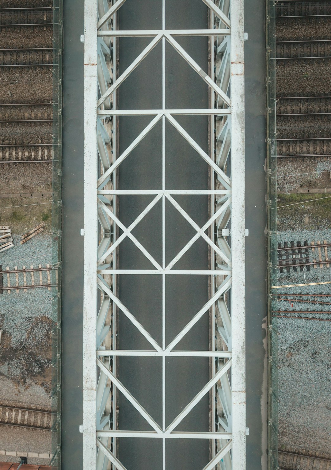 aerial-view-of-a-white-metal-bridge-over-a-river-wpaicdydyow